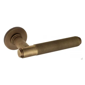 Дверная ручка на круглом основании Venezia \"EXA ZIG\" FSR матовая бронза